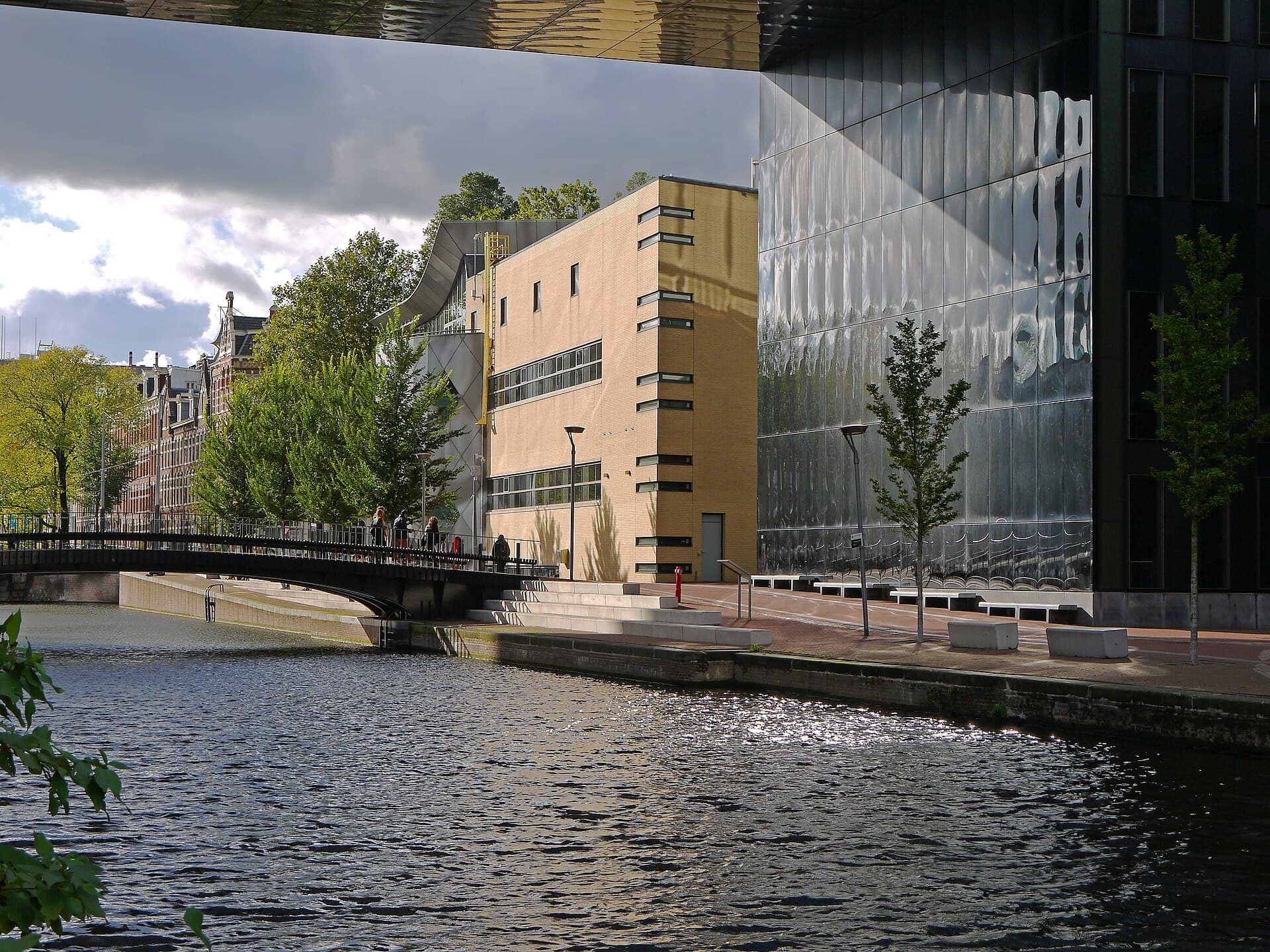 Modern university buildings beside a canal